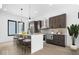 Modern kitchen featuring pendant lighting, stainless appliances, a central island, and dark cabinetry at 1100 English Ave, Indianapolis, IN 46203