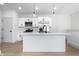 Modern kitchen with white cabinets, stainless steel appliances, and a large island at 1100 English Ave, Indianapolis, IN 46203