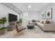 Well-lit living room with contemporary furniture, art, and hardwood floors at 1100 English Ave, Indianapolis, IN 46203