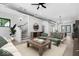 Open-concept living room with stairs, modern furnishings, and an abundance of natural light at 1100 English Ave, Indianapolis, IN 46203