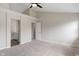 Spacious bedroom with vaulted ceilings, ceiling fan and ensuite bath with large vanity provides comfort and relaxation at 113 Spring Creek Ct, Noblesville, IN 46062