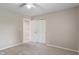 Neutral bedroom with a ceiling fan, carpet, and standard closet and doorway at 113 Spring Creek Ct, Noblesville, IN 46062