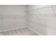 Spacious walk-in closet with ample shelving and neutral carpet, offering convenient and organized storage solutions at 113 Spring Creek Ct, Noblesville, IN 46062