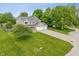 A well-maintained home is enhanced by a large front yard and a three-car garage, complete with a basketball hoop at 113 Spring Creek Ct, Noblesville, IN 46062