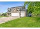 Two-story home with attached garage and driveway at 113 Spring Creek Ct, Noblesville, IN 46062