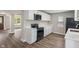 Kitchen features black appliances and hard flooring at 113 Spring Creek Ct, Noblesville, IN 46062