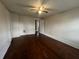 Bedroom featuring hardwood floors and a ceiling fan with light fixture at 1137 W 34Th St, Indianapolis, IN 46208