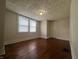 Bedroom featuring hardwood floors and a window letting in natural light at 1137 W 34Th St, Indianapolis, IN 46208