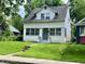 Two-story home featuring a well-maintained lawn, creating a welcoming curb appeal at 1137 W 34Th St, Indianapolis, IN 46208