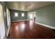 A spacious living room featuring gleaming hardwood floors and an open floor plan at 1137 W 34Th St, Indianapolis, IN 46208