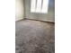 Bright bedroom with wall to wall carpeting, light walls, and natural light from the window at 1150 Canterbury Ct # Apt D, Indianapolis, IN 46260
