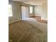Living room featuring carpet, neutral walls, and a sliding glass door at 1150 Canterbury Ct # Apt D, Indianapolis, IN 46260