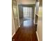 Open doorway to a carpeted living room with sliding glass doors and light-colored walls at 1150 Canterbury Ct # Apt D, Indianapolis, IN 46260