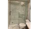 Sleek and modern bathroom featuring white marble tiles and glass shower at 1150 Canterbury Ct # Apt D, Indianapolis, IN 46260