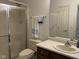 Bathroom featuring a shower with glass doors and a single sink vanity at 11523 Coastal Way, Indianapolis, IN 46229