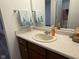 Bathroom featuring a single sink vanity and a mirror with decorative towels at 11523 Coastal Way, Indianapolis, IN 46229