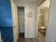 View into a bathroom with a shower; storage space visible in hall at 11523 Coastal Way, Indianapolis, IN 46229