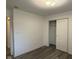 Bedroom featuring wood-look floors, closet and neutral paint at 11523 Coastal Way, Indianapolis, IN 46229