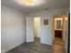 This bedroom features modern gray flooring and access to the bathroom and closet at 11523 Coastal Way, Indianapolis, IN 46229