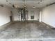 An empty garage with some utilities has lots of open parking space at 11523 Coastal Way, Indianapolis, IN 46229