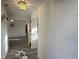 Hallway with hardwood floors leading to living areas and bedrooms at 11523 Coastal Way, Indianapolis, IN 46229