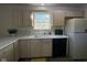 Kitchen showcasing ample counter space, black dishwasher, and white refrigerator at 11523 Coastal Way, Indianapolis, IN 46229