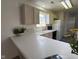 Bright kitchen featuring lots of cabinets, long countertops, and a window at 11523 Coastal Way, Indianapolis, IN 46229