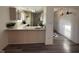 Open kitchen overlooking breakfast bar and hardwood floors in living area at 11523 Coastal Way, Indianapolis, IN 46229