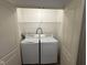 Conveniently located laundry closet with shelving at 11523 Coastal Way, Indianapolis, IN 46229