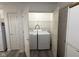 Conveniently located laundry closet with shelving at 11523 Coastal Way, Indianapolis, IN 46229