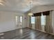 Hardwood floors in open-concept living room with natural light at 11523 Coastal Way, Indianapolis, IN 46229