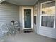 Inviting front porch with welcome mat and seasonal decor at 11523 Coastal Way, Indianapolis, IN 46229