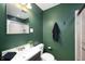 Bathroom showing a sink, toilet, and glass door shower at 117 S Spencer Ave, Indianapolis, IN 46219