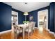 Well-lit dining room with a view into an open-concept living space at 117 S Spencer Ave, Indianapolis, IN 46219