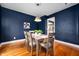 Elegant dining room with hardwood floors and stylish light fixture at 117 S Spencer Ave, Indianapolis, IN 46219