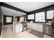 Bright and airy kitchen with a breakfast bar and stainless steel appliances at 117 S Spencer Ave, Indianapolis, IN 46219