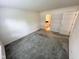Spacious bedroom with neutral walls, comfortable carpeting, and access to an en-suite bathroom and closet at 11711 Whisper Cove Dr, Fishers, IN 46037