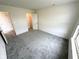 Spacious carpeted bedroom with a closet and two doors, providing comfort and convenience at 11711 Whisper Cove Dr, Fishers, IN 46037