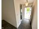 Inviting foyer with new floor and a view of the front yard through the open front door at 11711 Whisper Cove Dr, Fishers, IN 46037