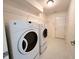 Practical laundry room with a washer, dryer, shelving and plenty of space for organization and efficiency at 11711 Whisper Cove Dr, Fishers, IN 46037
