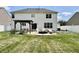 A large backyard with a patio, fire pit, pergola, and garden at 12044 Bird Key Blvd, Fishers, IN 46037