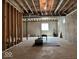 Unfinished basement features concrete flooring and walls, exposed ductwork and ceiling beams, and natural light at 12044 Bird Key Blvd, Fishers, IN 46037