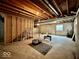 Spacious unfinished basement with exposed ceiling beams, concrete walls, and a framed room area at 12044 Bird Key Blvd, Fishers, IN 46037