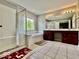 Bright bathroom with glass-enclosed shower, soaking tub, and large vanity with double sinks at 12044 Bird Key Blvd, Fishers, IN 46037