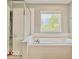 A close-up of the luxurious soaking tub and shower in this immaculate bathroom at 12044 Bird Key Blvd, Fishers, IN 46037