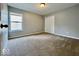 This simple bedroom has carpet, a large window, and a full-sized closet at 12044 Bird Key Blvd, Fishers, IN 46037