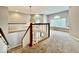 Beautiful foyer with a chandelier, staircase, and views of a loft area with window seat at 12044 Bird Key Blvd, Fishers, IN 46037