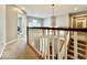 Open foyer featuring a chandelier, staircase, and views of the second floor loft at 12044 Bird Key Blvd, Fishers, IN 46037