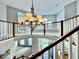 Stunning foyer with a chandelier, staircase, open views of the second floor, and access to front entrance at 12044 Bird Key Blvd, Fishers, IN 46037