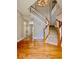 Inviting foyer with hardwood floors, a soaring ceiling, and a staircase leading to the upper level at 12044 Bird Key Blvd, Fishers, IN 46037